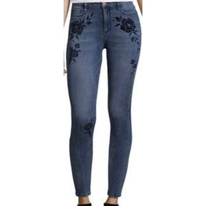 Skinny jeans with black floral detail.